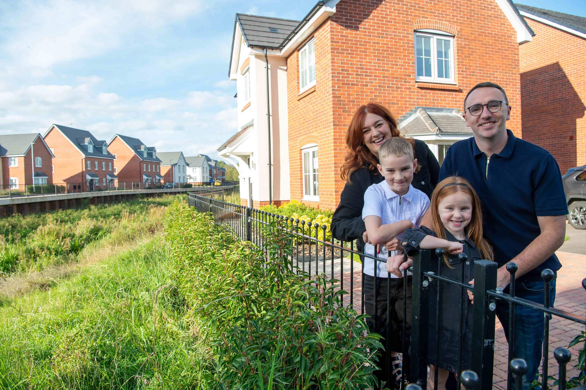 Eleanor and Kevin with their children outside their home