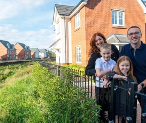 Bellway family outside their home