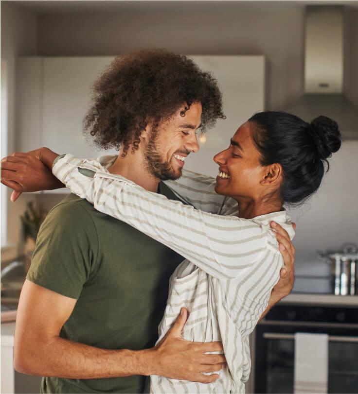 Couple in kitchen of new home